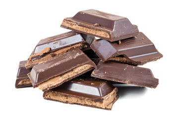 Heap of chocolate pieces on white background