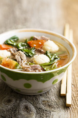 Asian soup with rice dumplings