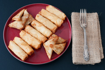 cheese filled rolls and meat stuffed triangle wraps