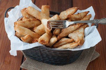 cheese filled rolls and meat stuffed triangle wraps