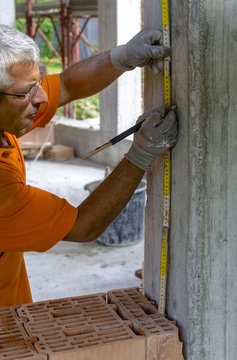 Construction worker placing slab formwork beams