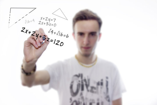 Man writes mathematical equations on whiteboard