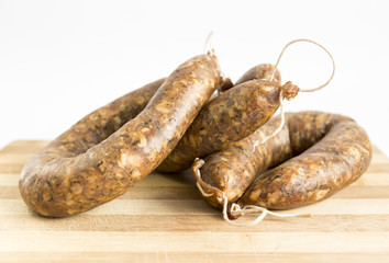 Raw flat sausages