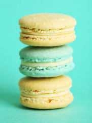 Gentle colorful macaroons on color background