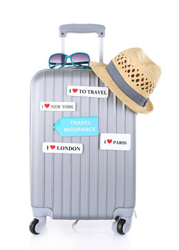 Travel suitcase and tourist stuff with inscription  travel