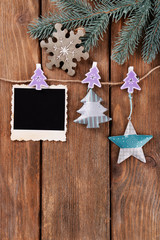 Blank photo frames and Christmas decor with snow fir tree