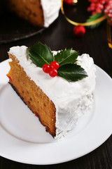 Slice of cake covered cream with Christmas decoration