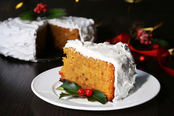 Slice of cake covered cream with Christmas decoration