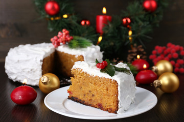 Fototapeta na wymiar Slice of cake covered cream with Christmas decoration