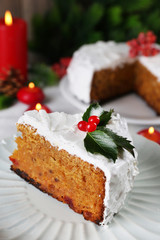 Slice of cake covered cream with Christmas decoration