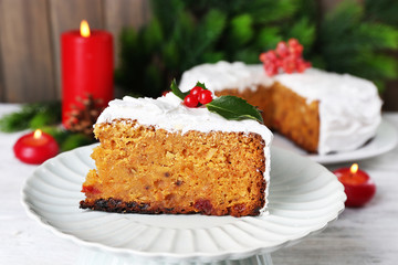 Slice of cake covered cream with Christmas decoration