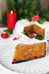 Slice of cake covered cream with Christmas decoration