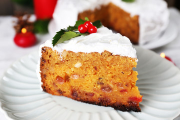 Slice of cake covered cream with Christmas decoration