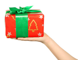 Female hand holding present box with ribbon on light background