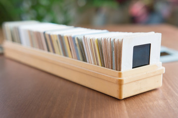 30 years old cardboard-framed  film slides in a plastic box