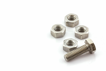 Metal screw and nuts on white background.