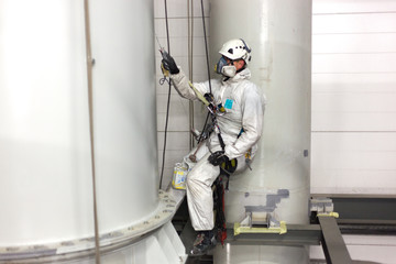 man painting with airbrush