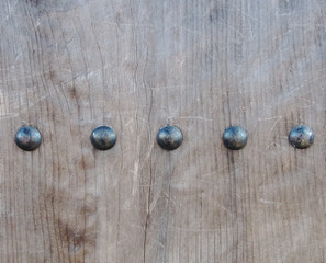 Obraz na płótnie Canvas Rustic rivets on old timber door