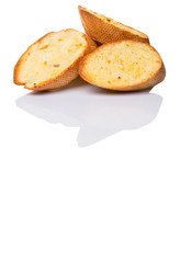 Homemade garlic bread of French baguette over white background