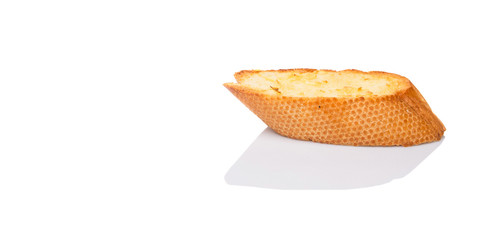 Homemade garlic bread of French baguette over white background