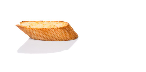 Homemade garlic bread of French baguette over white background