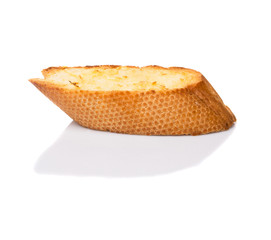 Homemade garlic bread of French baguette over white background