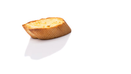 Homemade garlic bread of French baguette over white background