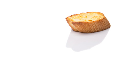 Homemade garlic bread of French baguette over white background