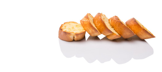 Homemade garlic bread of French baguette over white background