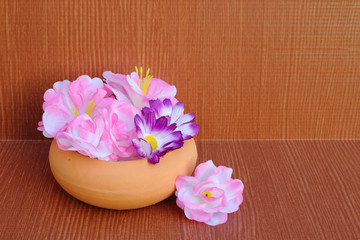 Obraz na płótnie Canvas artificial flower in pottery