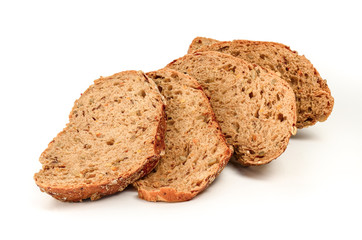 The pieces of cut brown bread close on a white background