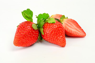 Three fresh strawberries isolated on white background