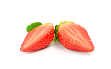 Fresh strawberries cut in half on a white background