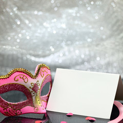 Vintage carnival mask and white blank card 