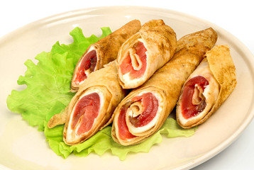 Crispy pancakes with salmon and greens salad on white background