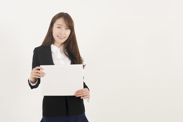 Naklejka premium Young Asian Woman Holding a Blank White Sign