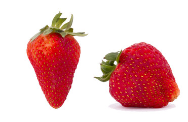 red strawberries with leaves isolated on white background.