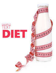 Bottle of yogurt with measuring tape isolated