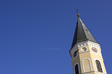 velika gorica church tower and plane trail