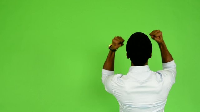 young handsome black man rejoices (back) - green screen