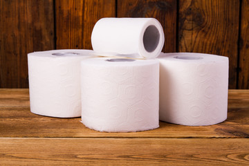 Toilet paper on a wooden table