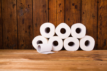 Toilet paper on a wooden table