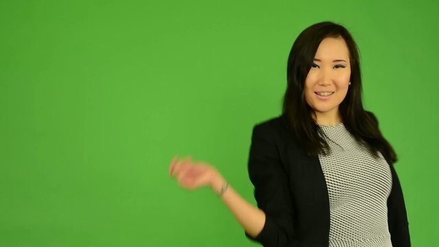 Young Attractive Asian Woman Dancing - Green Screen Studio