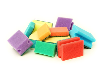 A lot of colourful sponges on a white background