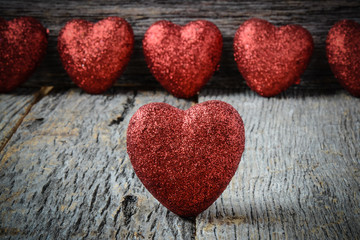 Obraz na płótnie Canvas Hearts on Vintage Wood Background for Valentine's Day