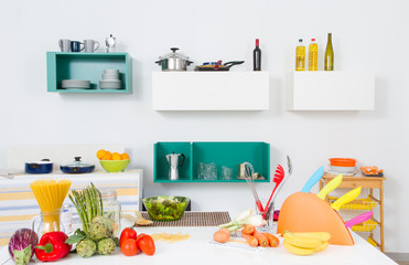 A kitchen with healthy food and utensils