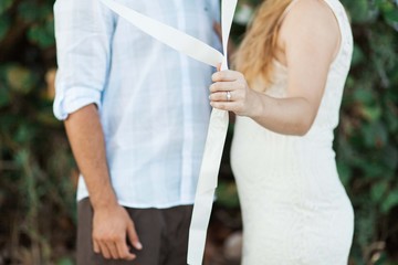 Engaged couple that are holding balloons