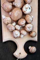 Raw mushrooms with brown hat