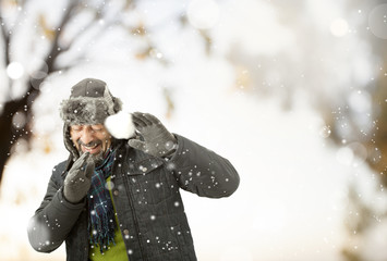 A man playing with snow