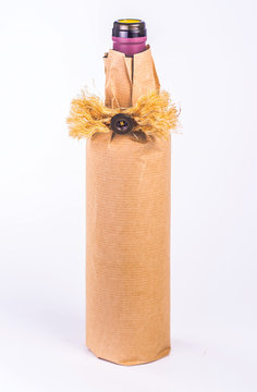 one bottle wrapped in paper with decoration